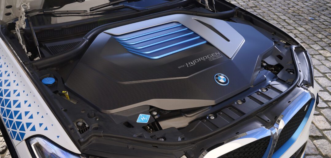the engine of a bmw car with its hood open.